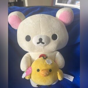 Korilakkuma (the white bear cub) holding Kiiroitori (the yellow chick) by San-X!